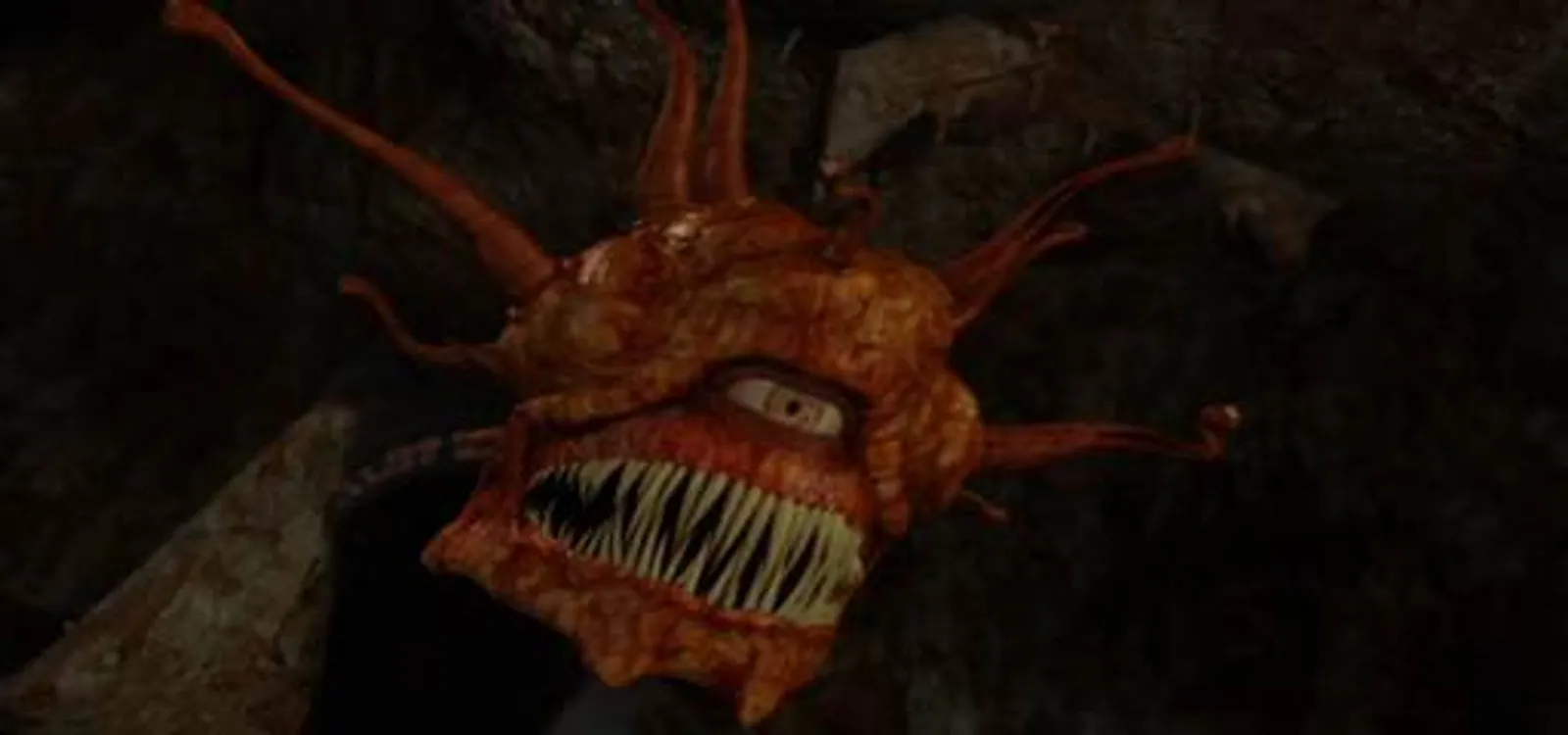 A beholder rises from the dark to bar the party's path